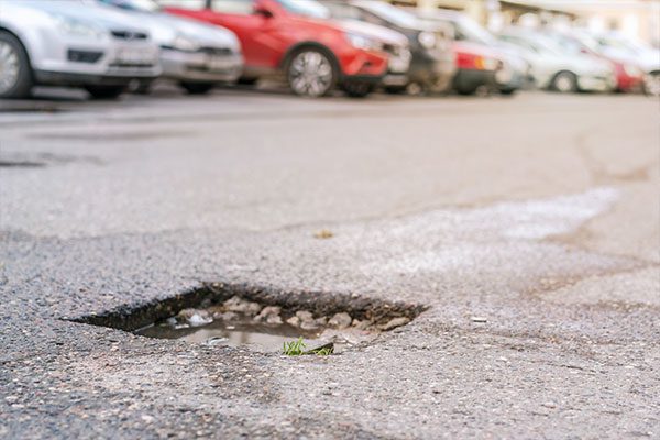 Parking lot with a pothole